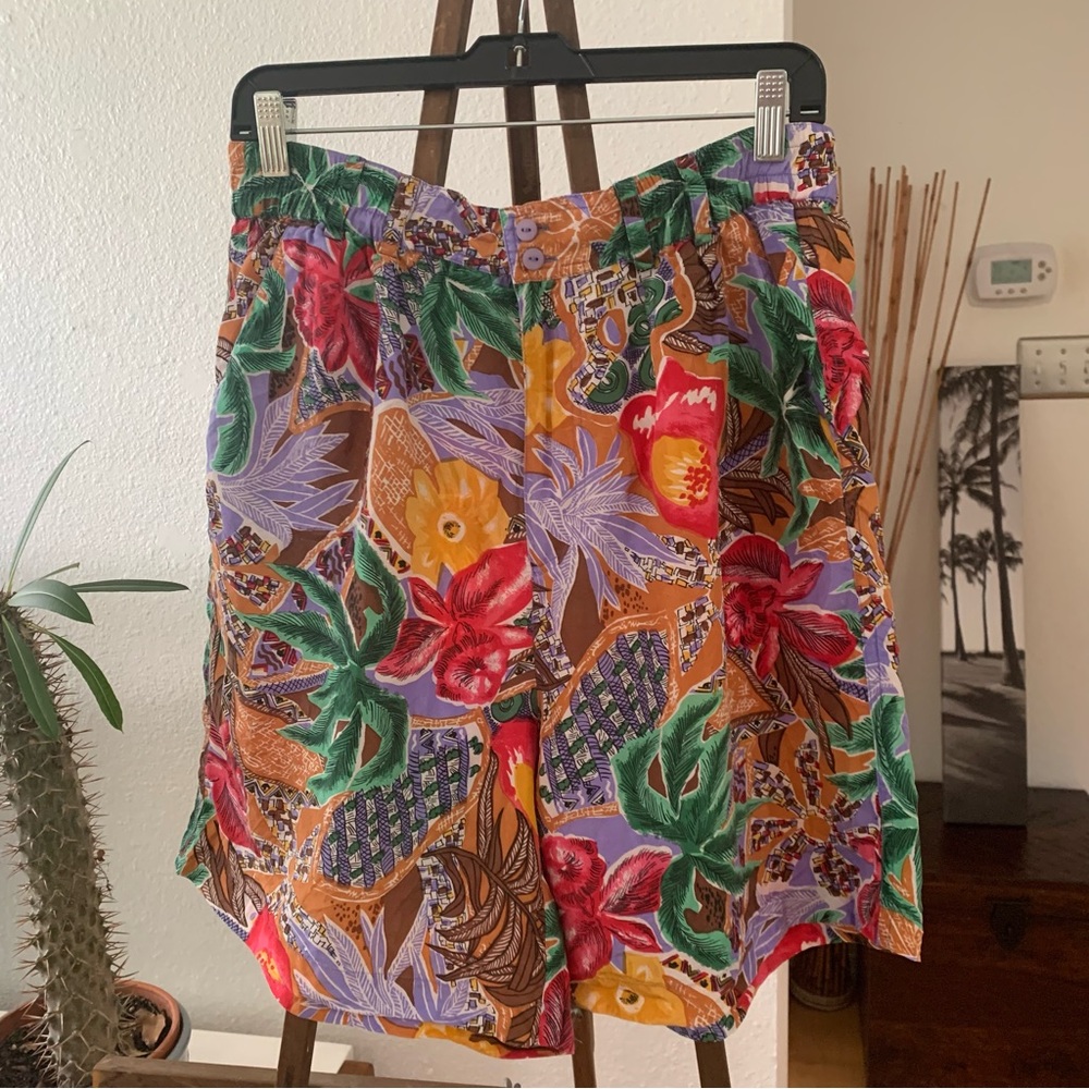 Silk Shorts with tropical themed print.  High waisted and wide legs; 2 pockets